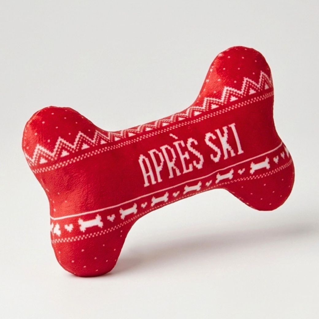 Coco & Pud - A red bone-shaped plush dog toy with white knit-style patterns and the text 'APRÈS SKI' on the front - Haute Diggity Dog
