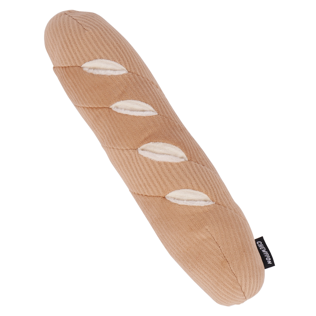 Coco & Pud Interactive Enrichment Baguette dog toy is a light brown bread-shaped toy with white pockets to hide treats - Chewffon