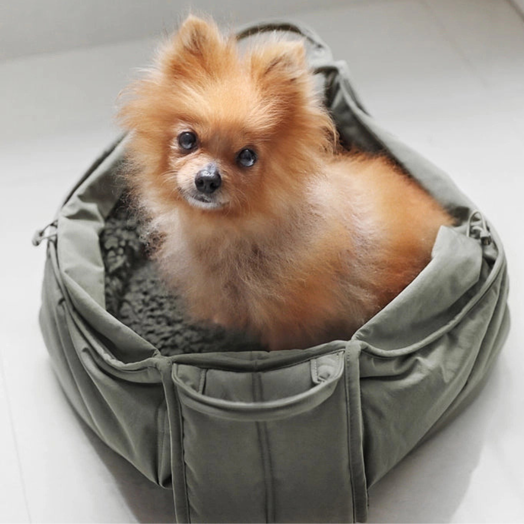 Coco & Pud - Olla soft pet carrier in olive green with Pomeranian dog inside - Lambwolf Collective