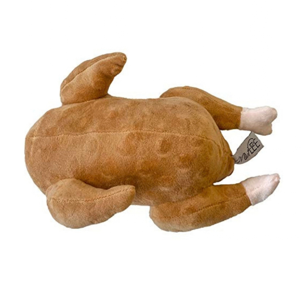 Coco & Pud - A plush stuffed roast turkey shaped dog toy, shown from a side angle on a plain white background. The toy is made of brown faux fur with lighter beige and white accents on the feet - Midlee Designs