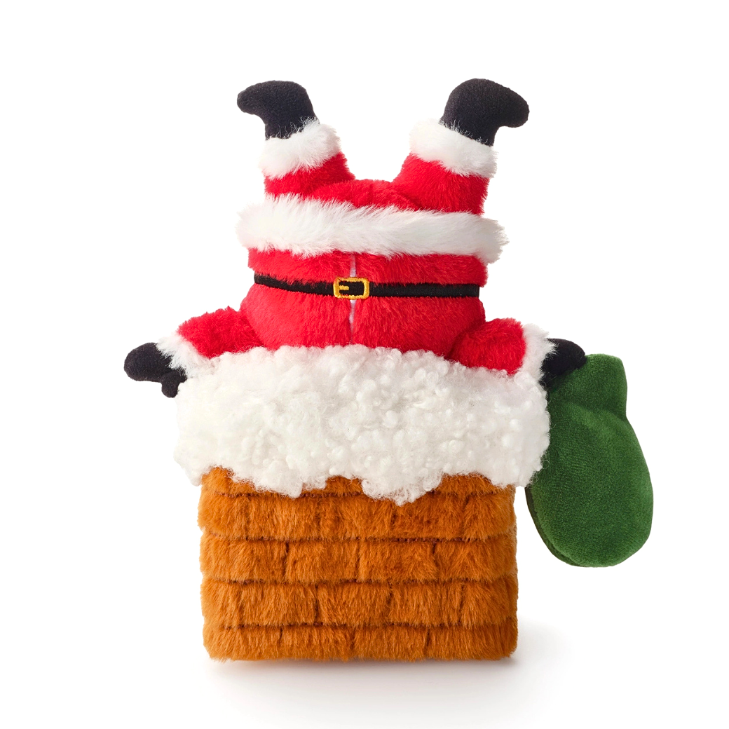 Coco & Pud - Here Comes Santa. A plush Santa Claus in a red suit, white fur trim, black gloves, a green sack, stuck upside down in a plush brick chimney dog toy - The Foggy Dog