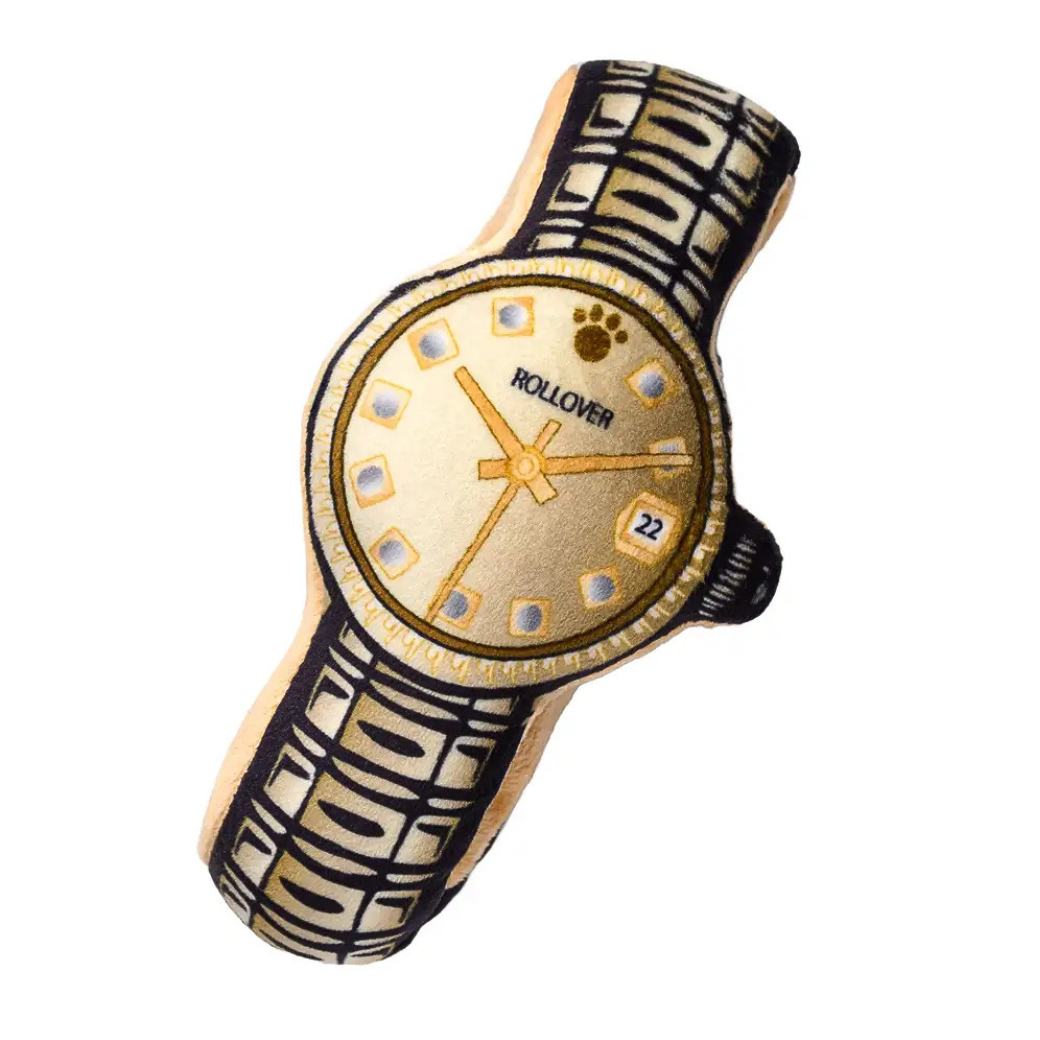 Coco & Pud - Rollover brand wristwatch plush dog toy with a gold-toned dial, gold hands and markers, and a black-and-cream patterned strap - Specks ad Pets