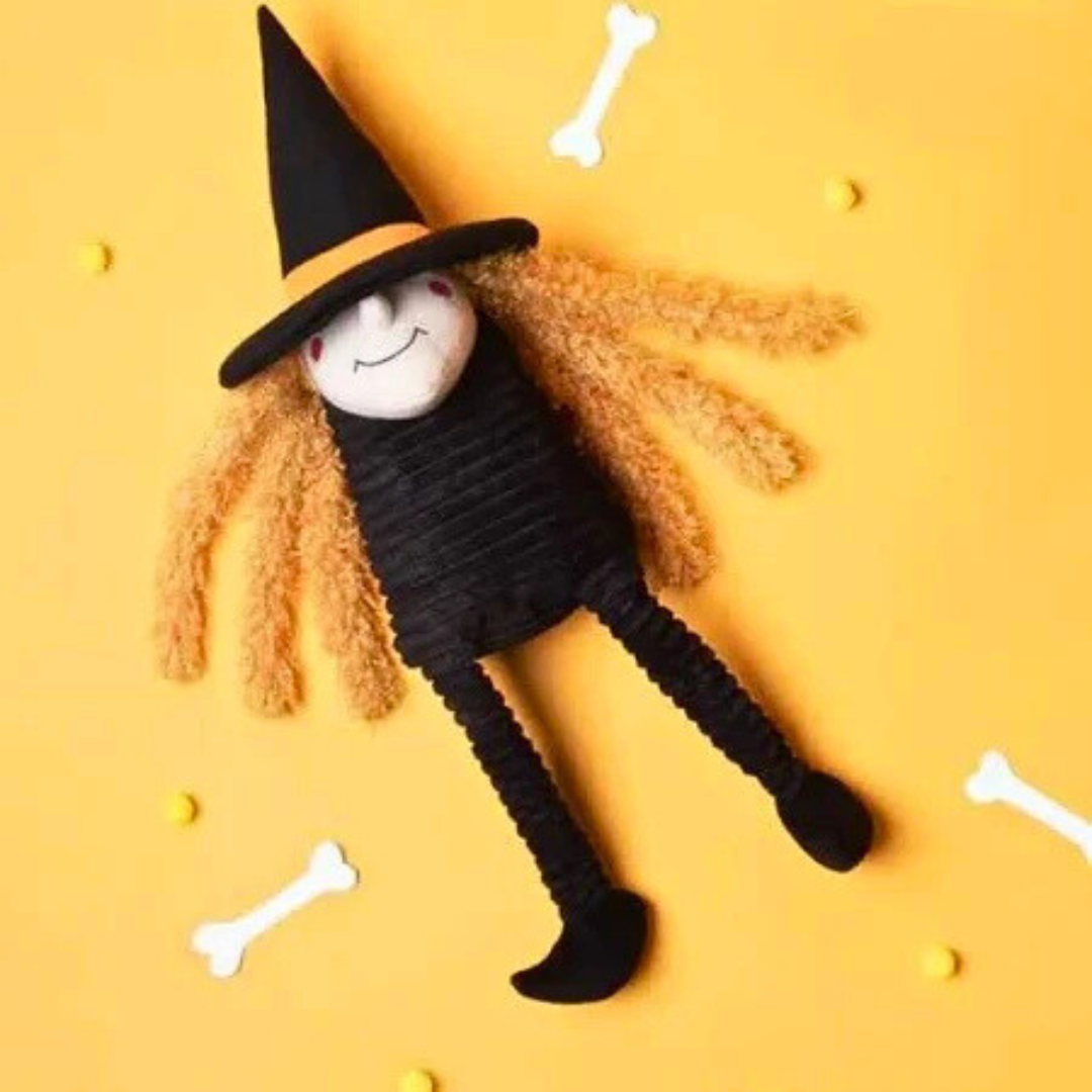 Coco & Pud Halloween Dog Toy witch with black hat, orange hair, and black shoes flat lay - Zippy Paws