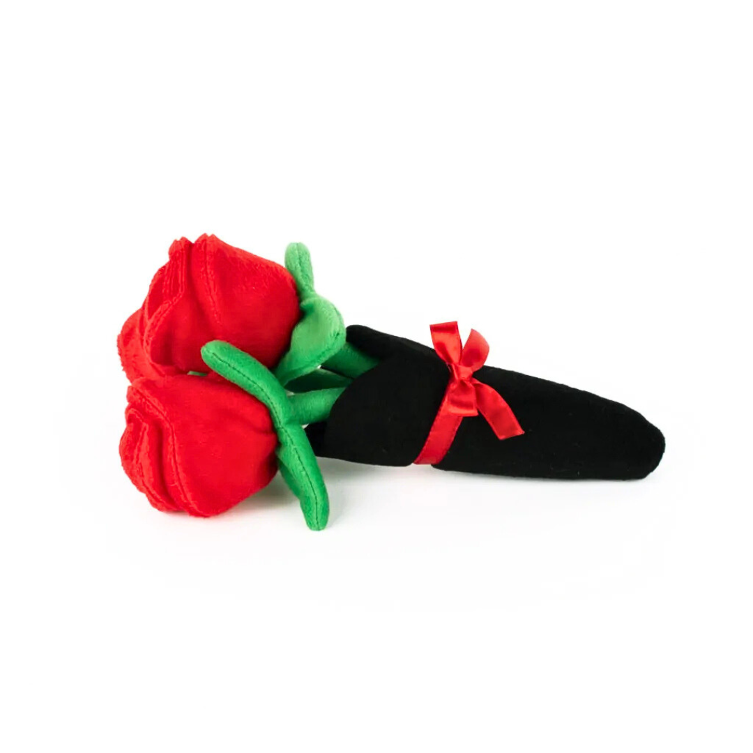 Coco & Pud Red rose-shaped dog toy with green stem and black sheath on a white background - Zippy Paws