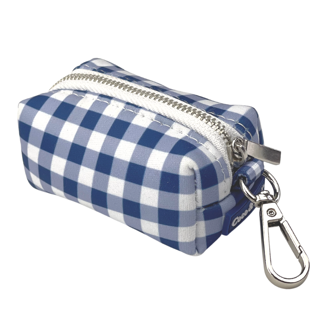 Coco & Pud -A small zippered Gingham Navy wast ebag holder with a blue and white gingham check pattern, featuring a silver metal carabiner clip attached to the side.